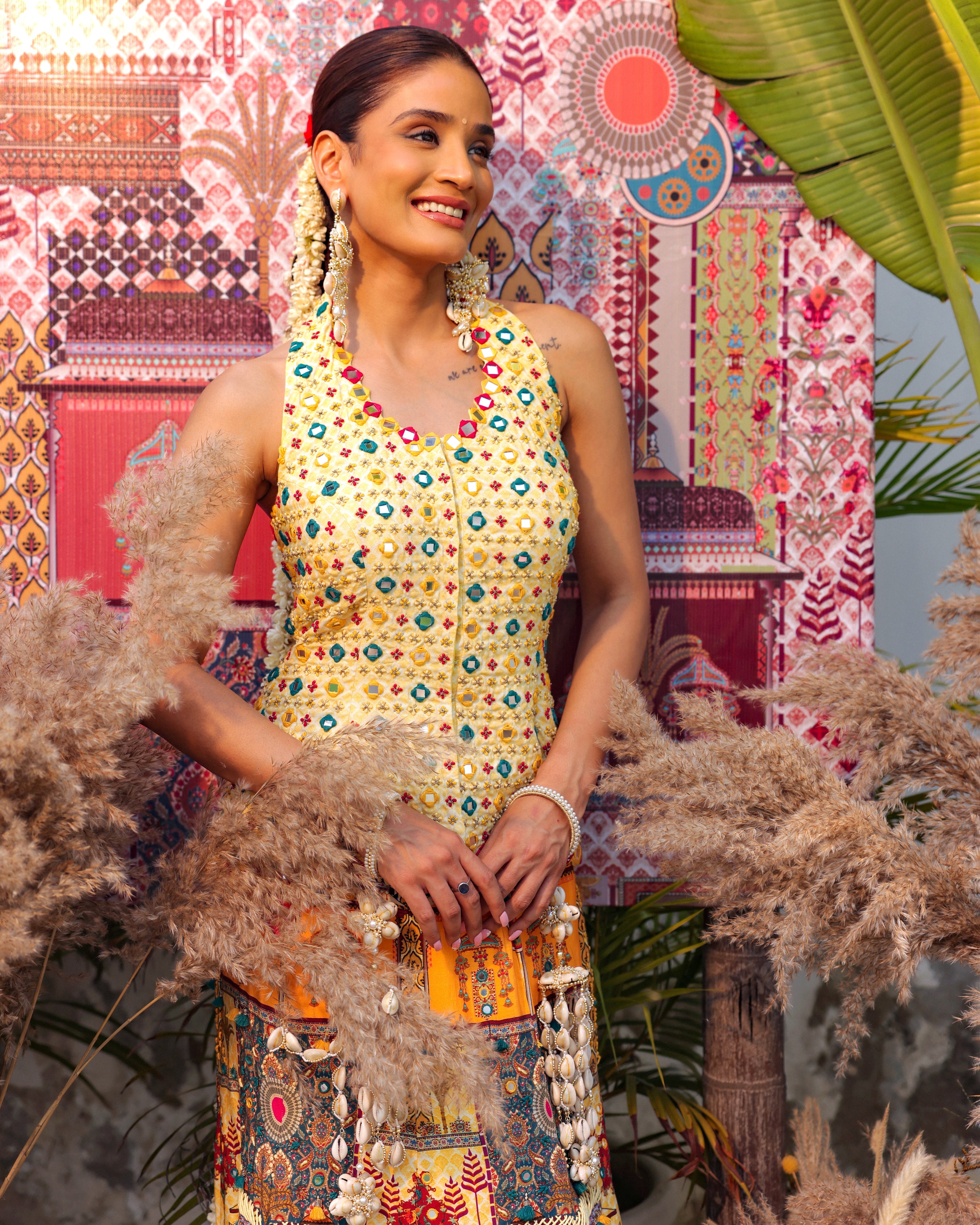 butter yellow halter neck peplum bodice with printed, embroidered multi-coloured lehenga set