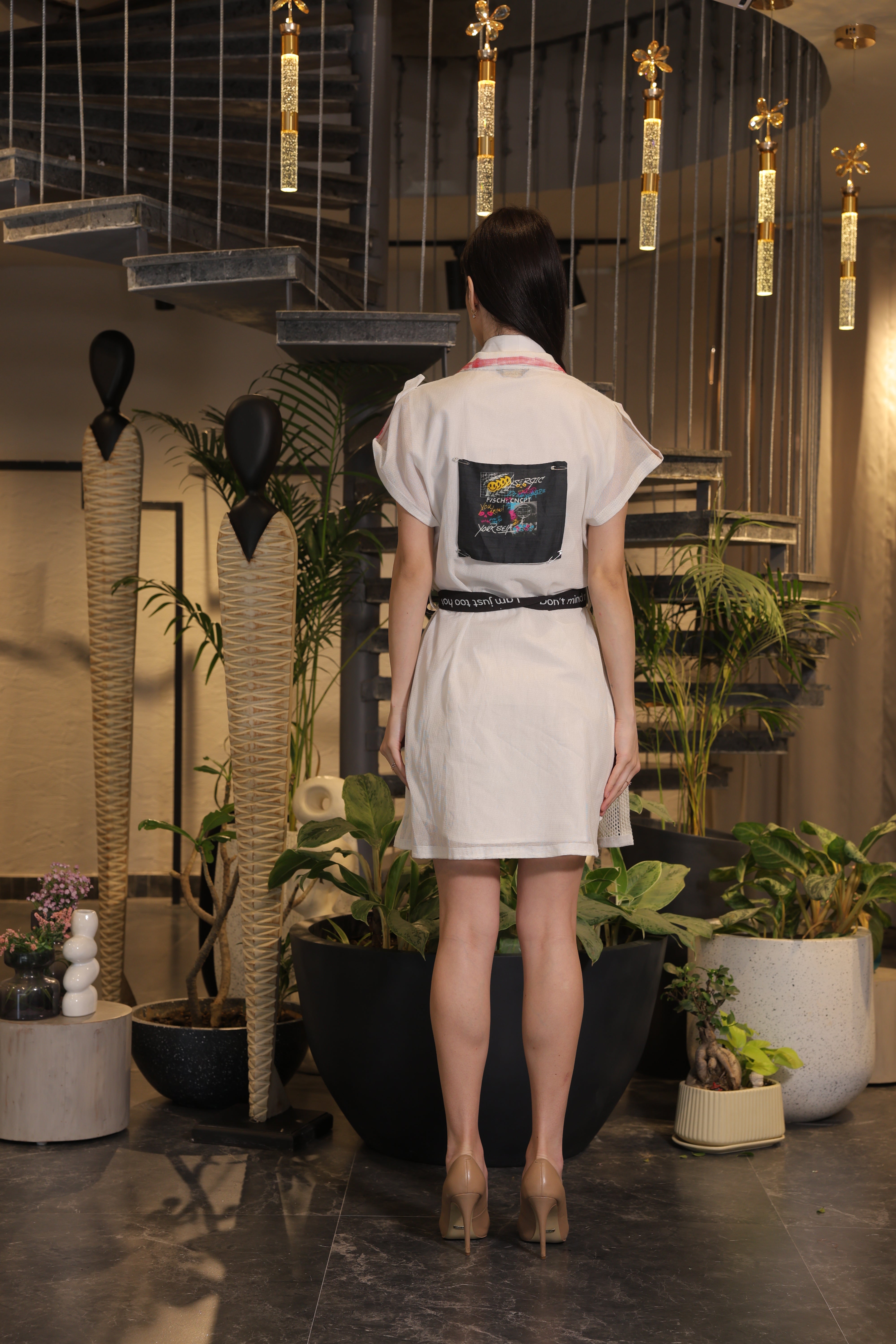 Off white crochet overlay dress with a belt and graphic printed pockets