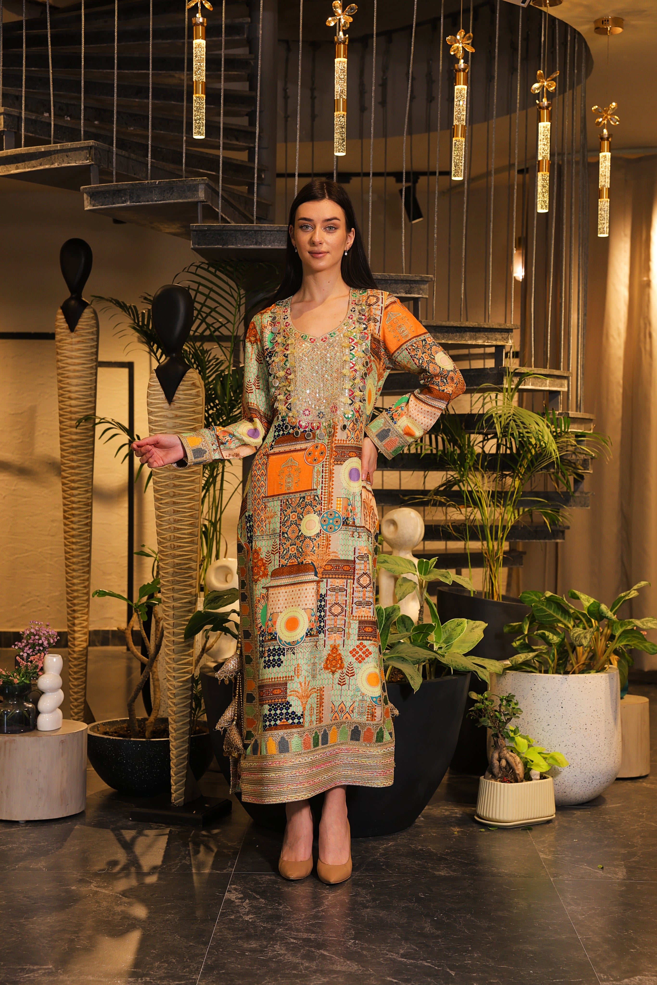 Long slit kurti , embellished with hand embroidery and tassels