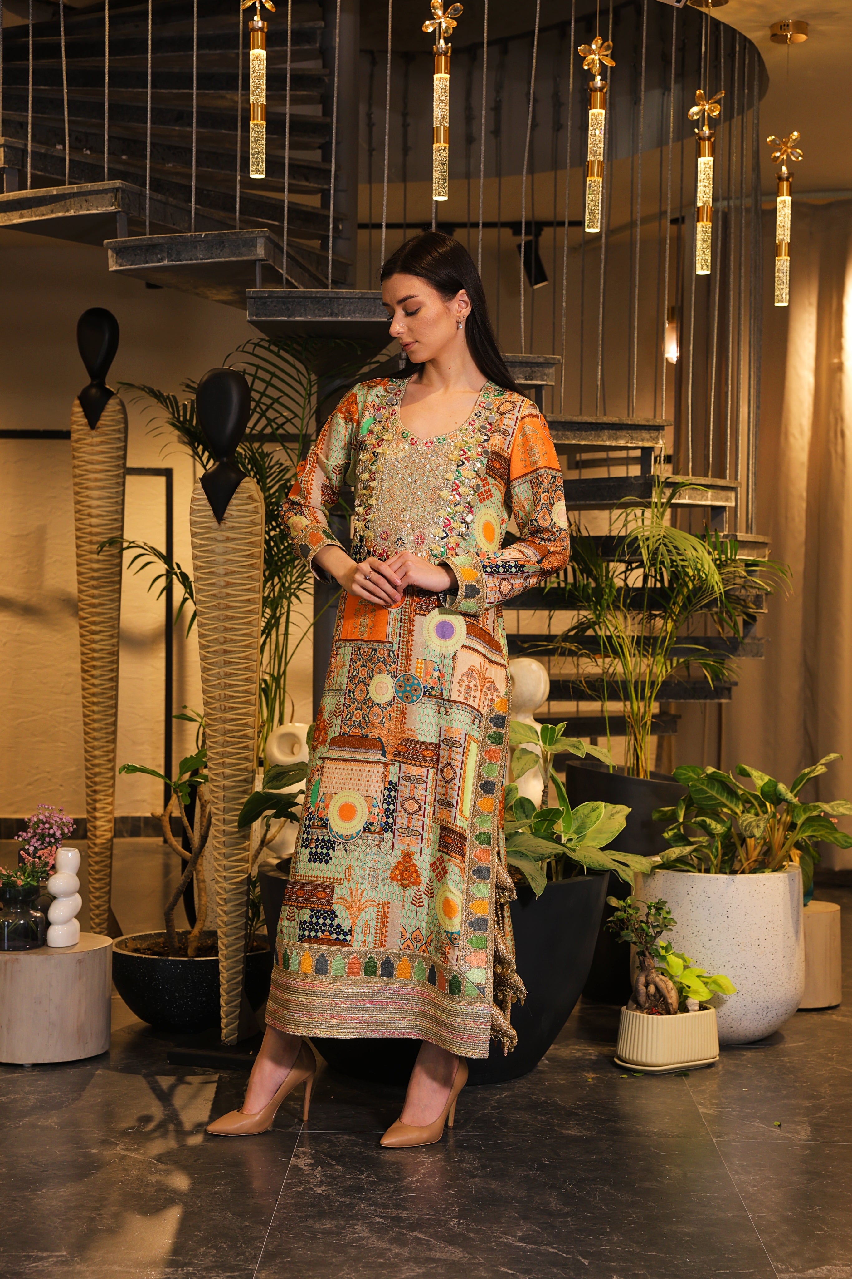 Long slit kurti , embellished with hand embroidery and tassels