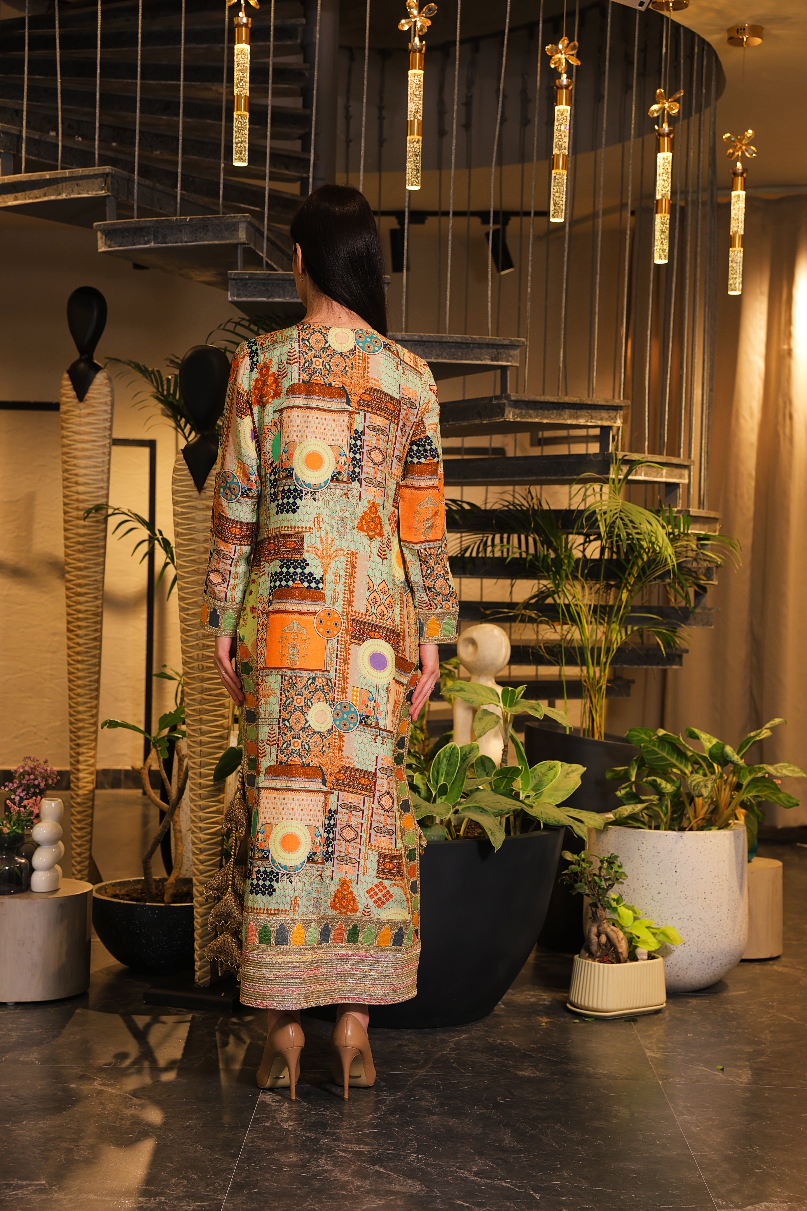 Long slit kurti , embellished with hand embroidery and tassels