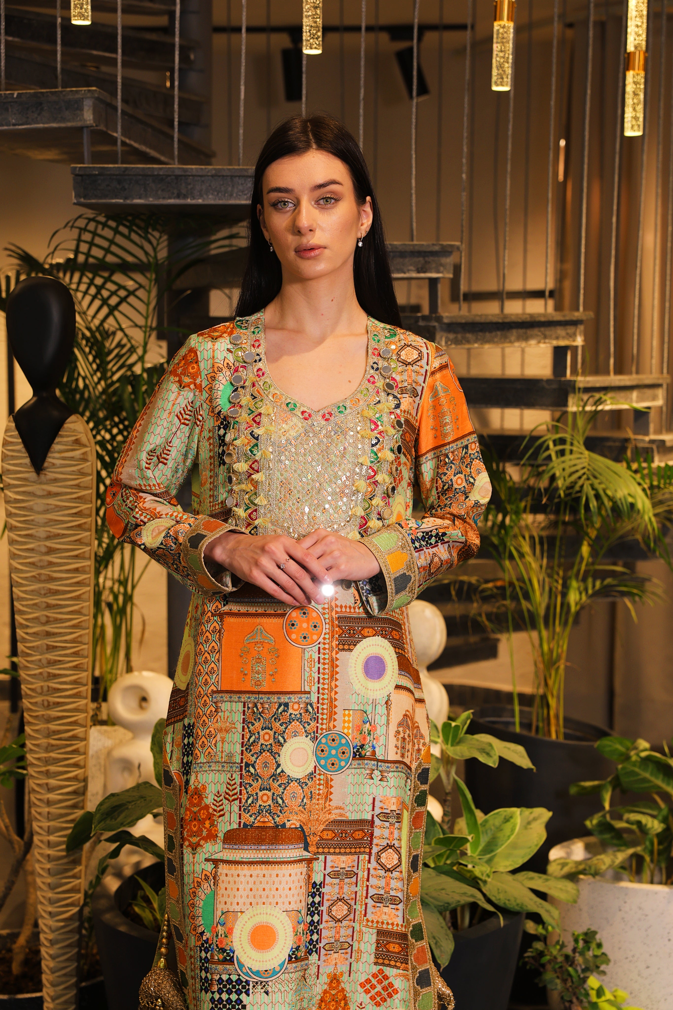 Long slit kurti , embellished with hand embroidery and tassels