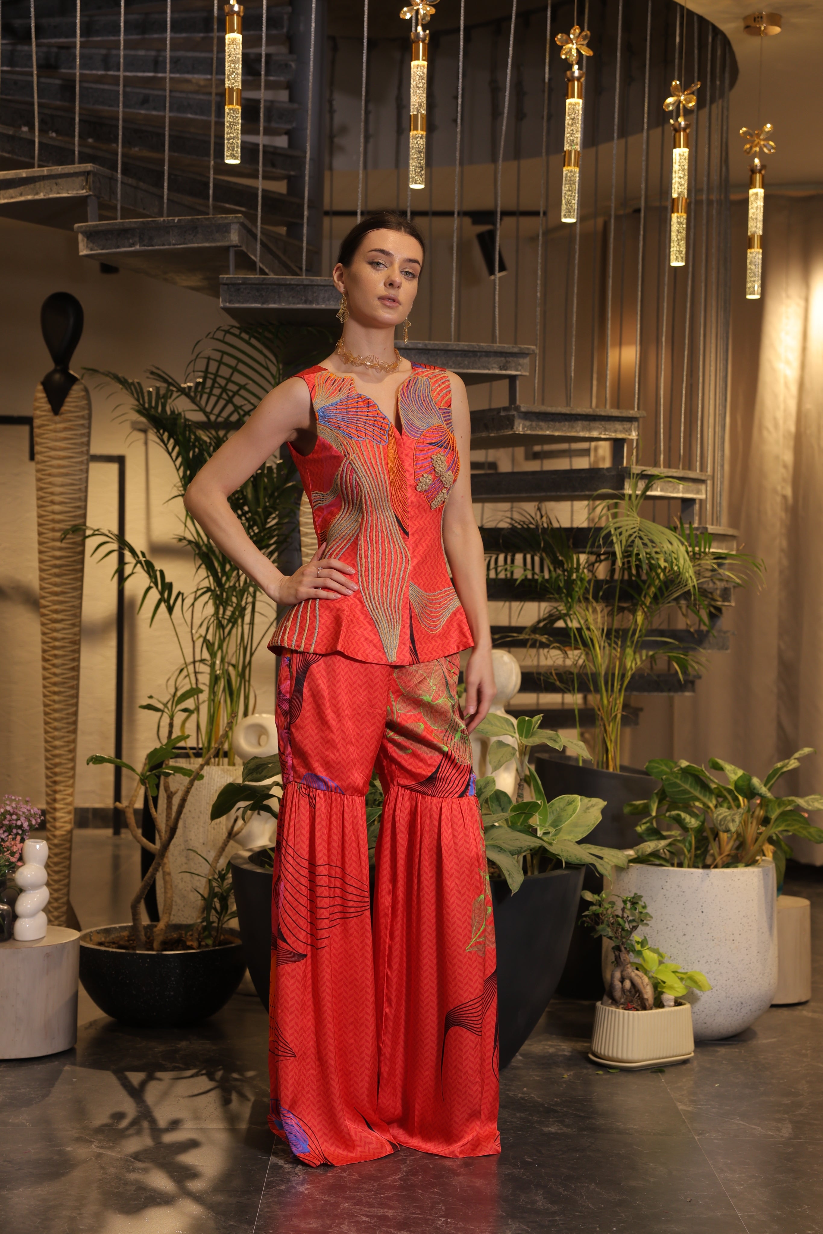 Crimson printed ethnosplash peplum cut bodice with garara pants.