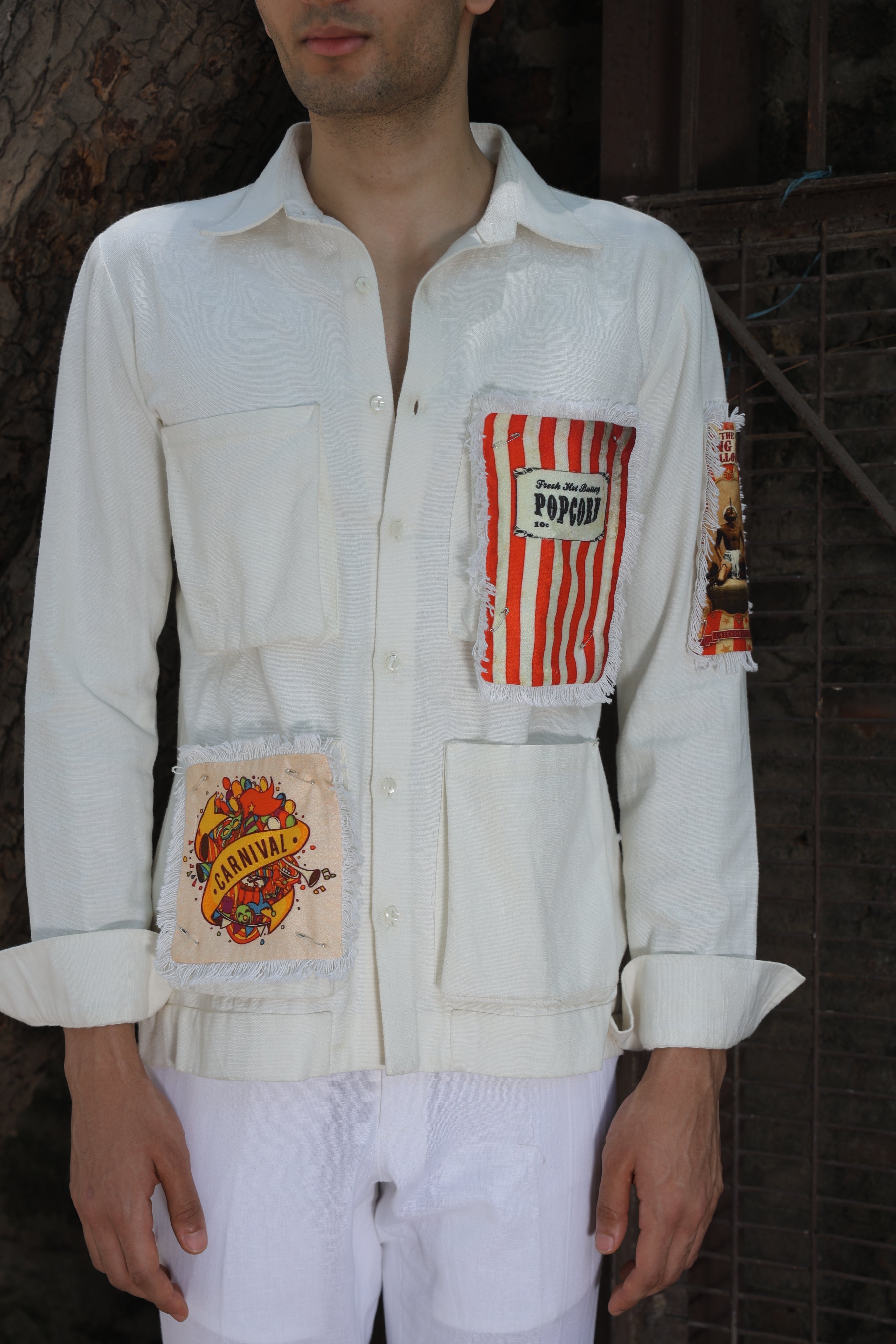 Off white shirt with large printed pockets paired with pants