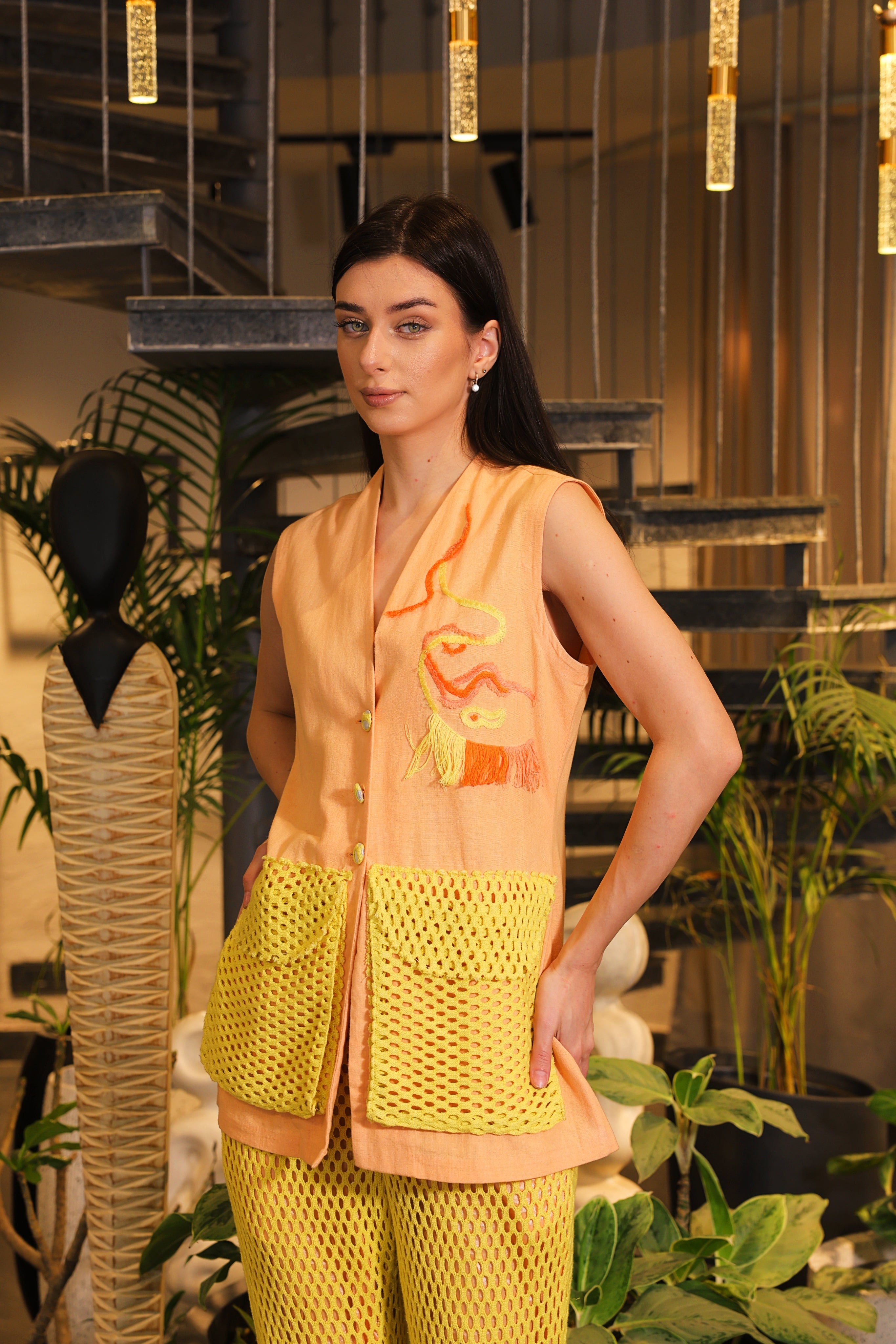 Shirt embellished with crochet pockets and crochet pants
