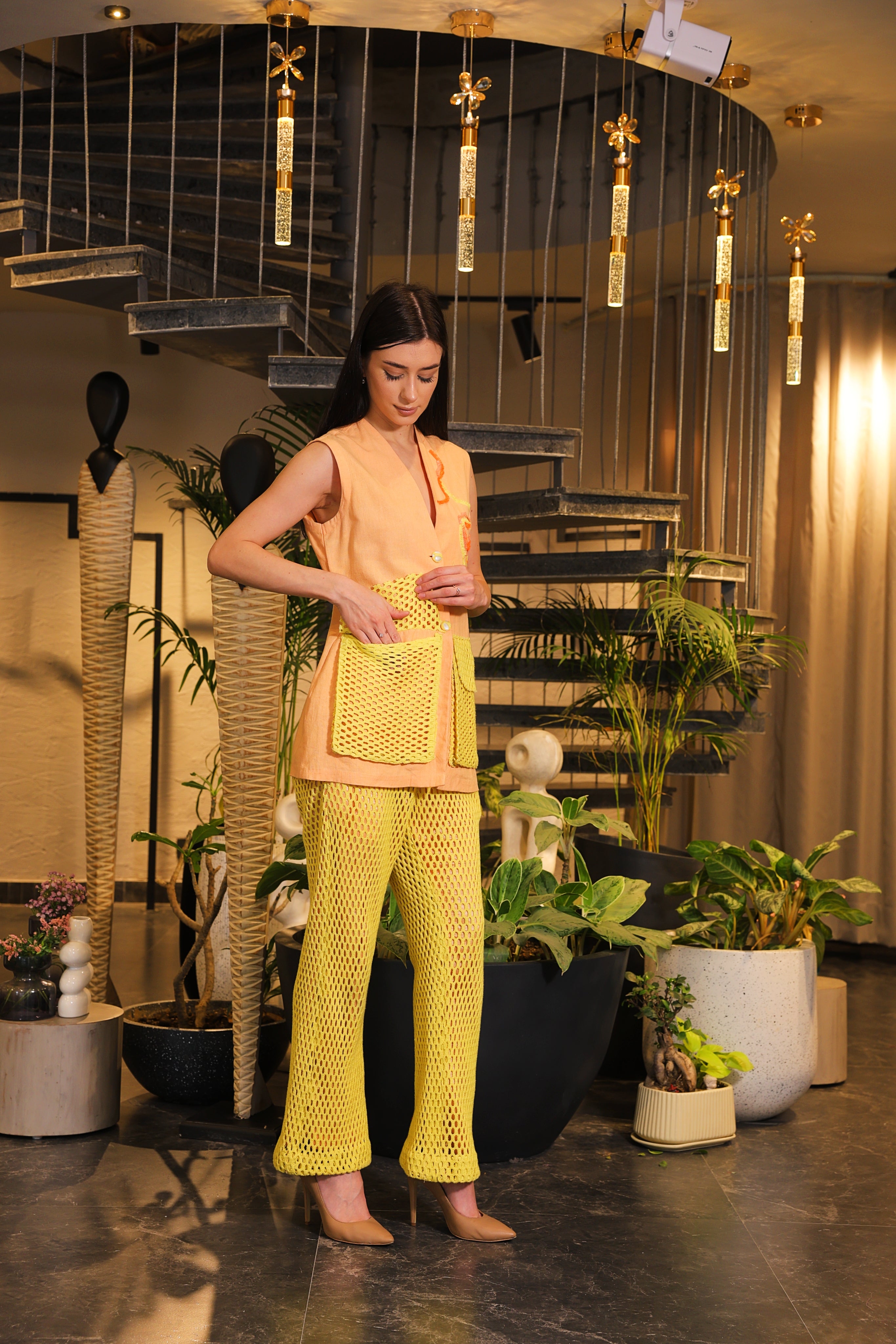 Shirt embellished with crochet pockets and crochet pants
