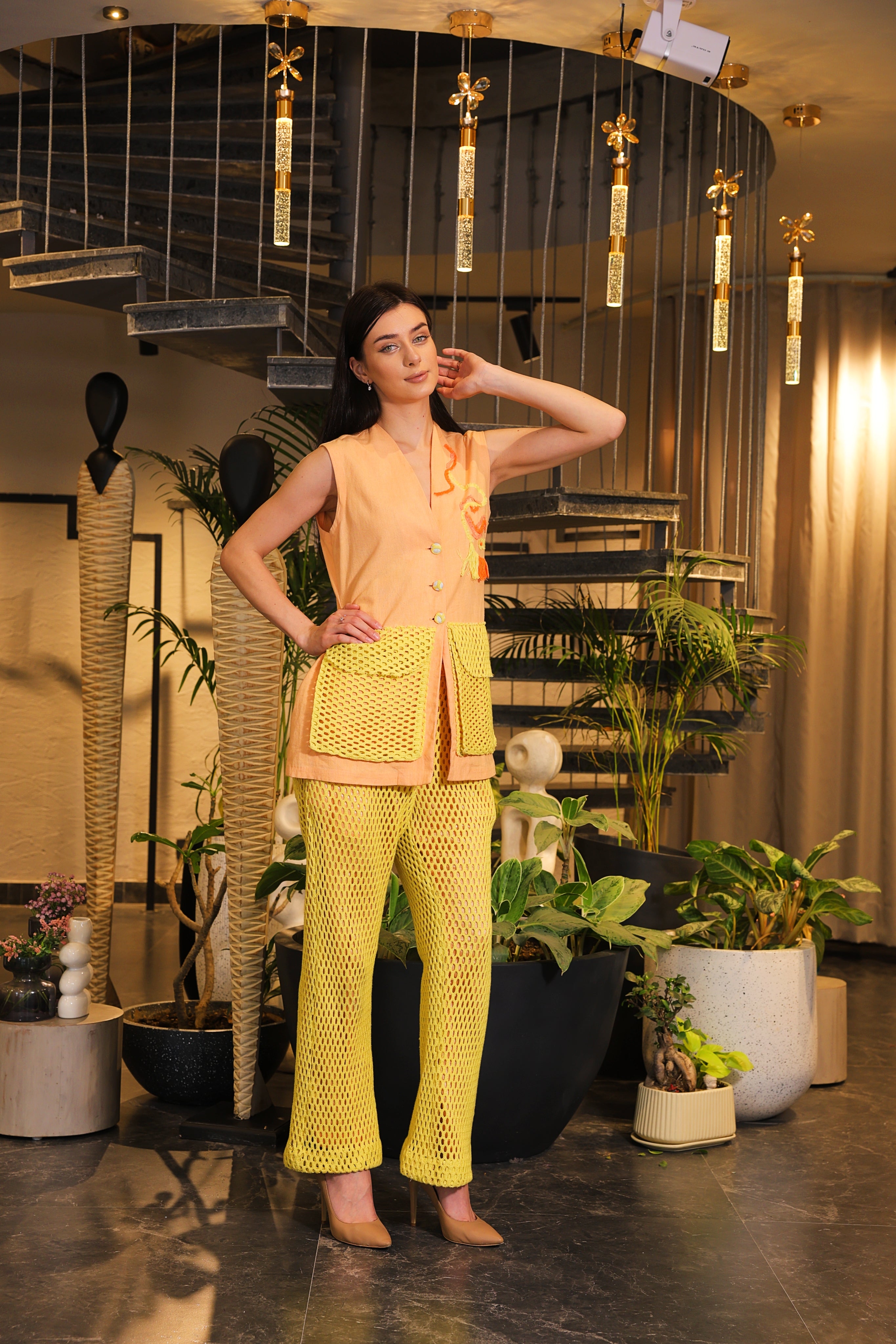 Shirt embellished with crochet pockets and crochet pants