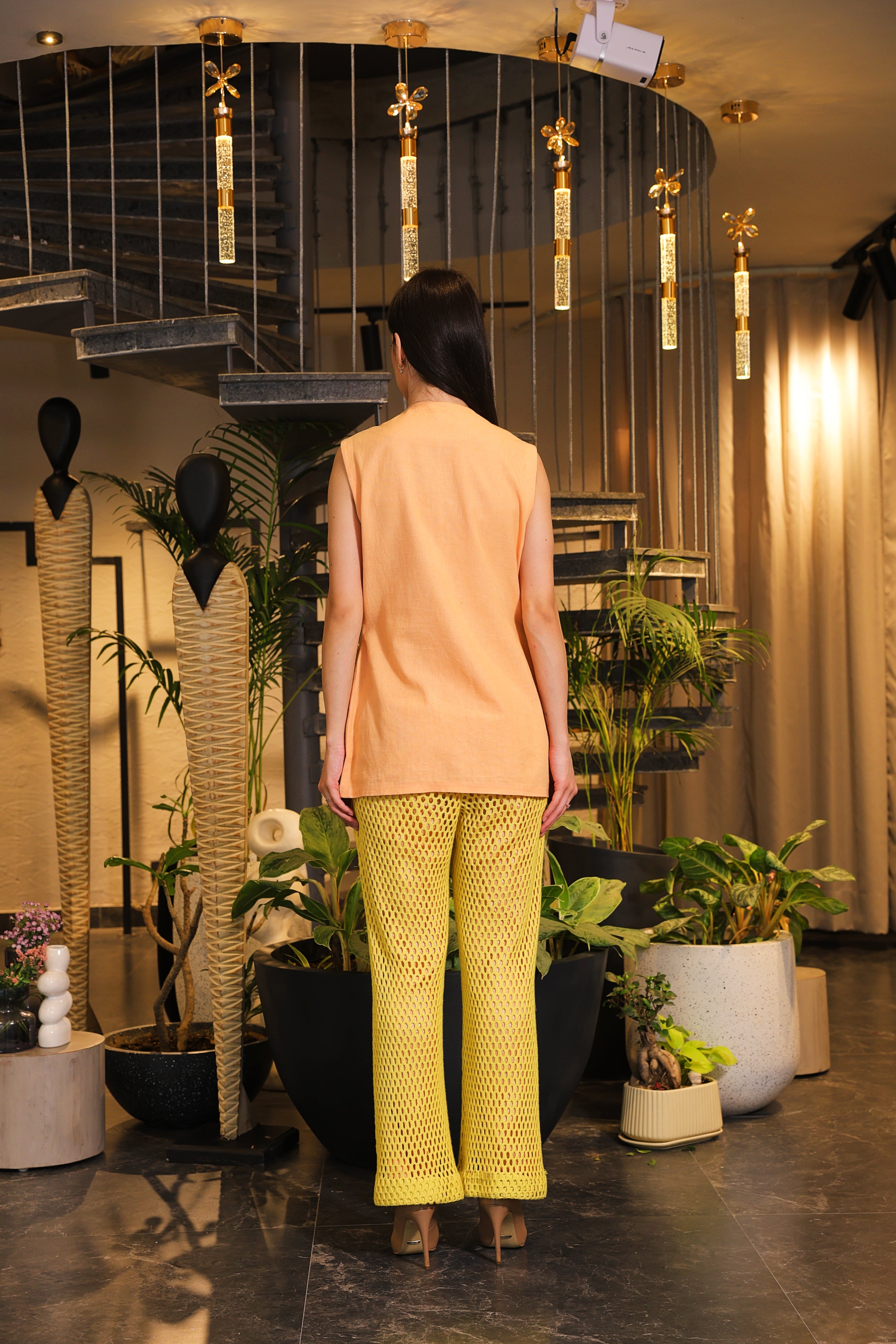 Shirt embellished with crochet pockets and crochet pants