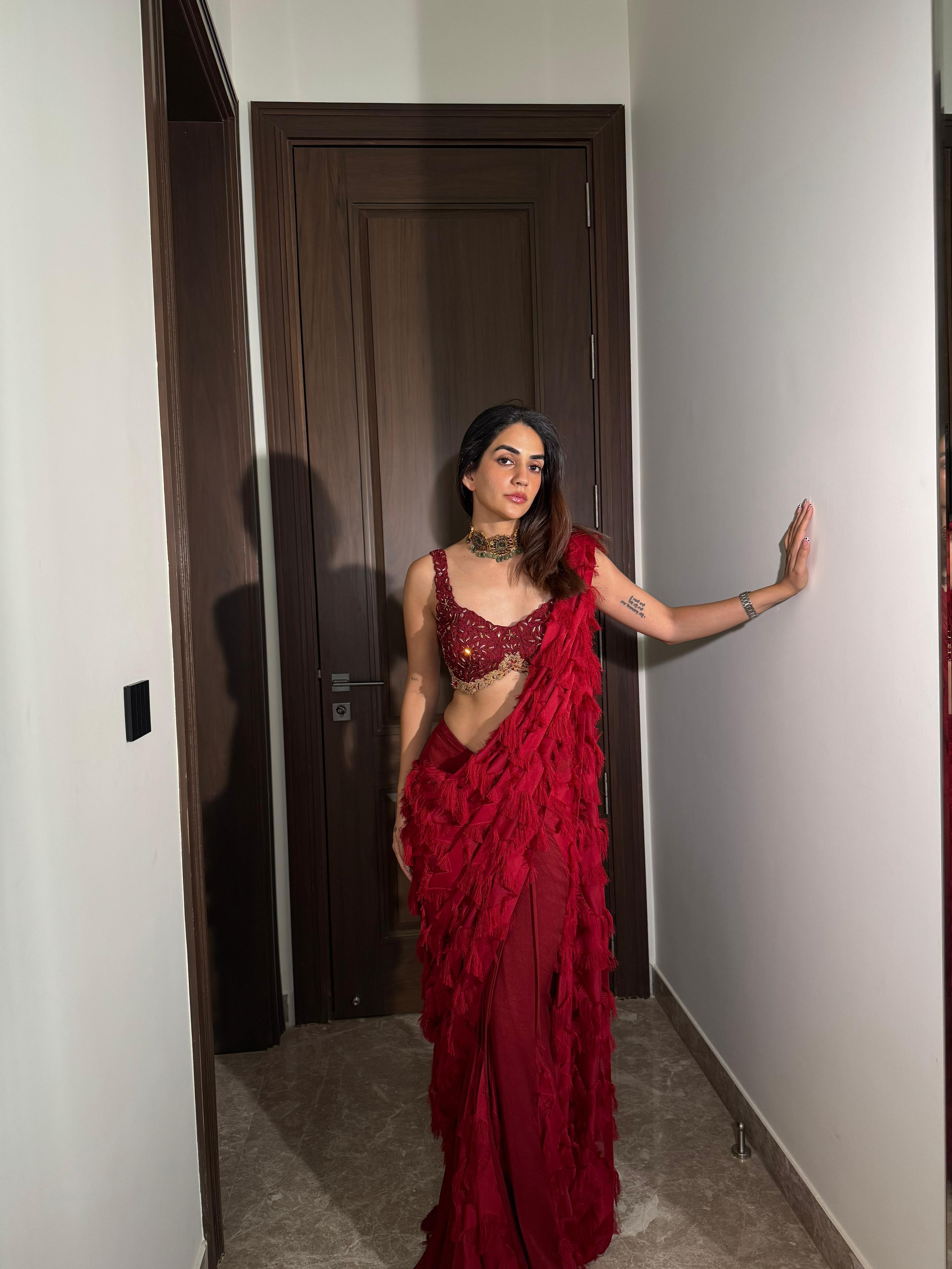 Karma Dhingra in ANKUR J red signature drape saree