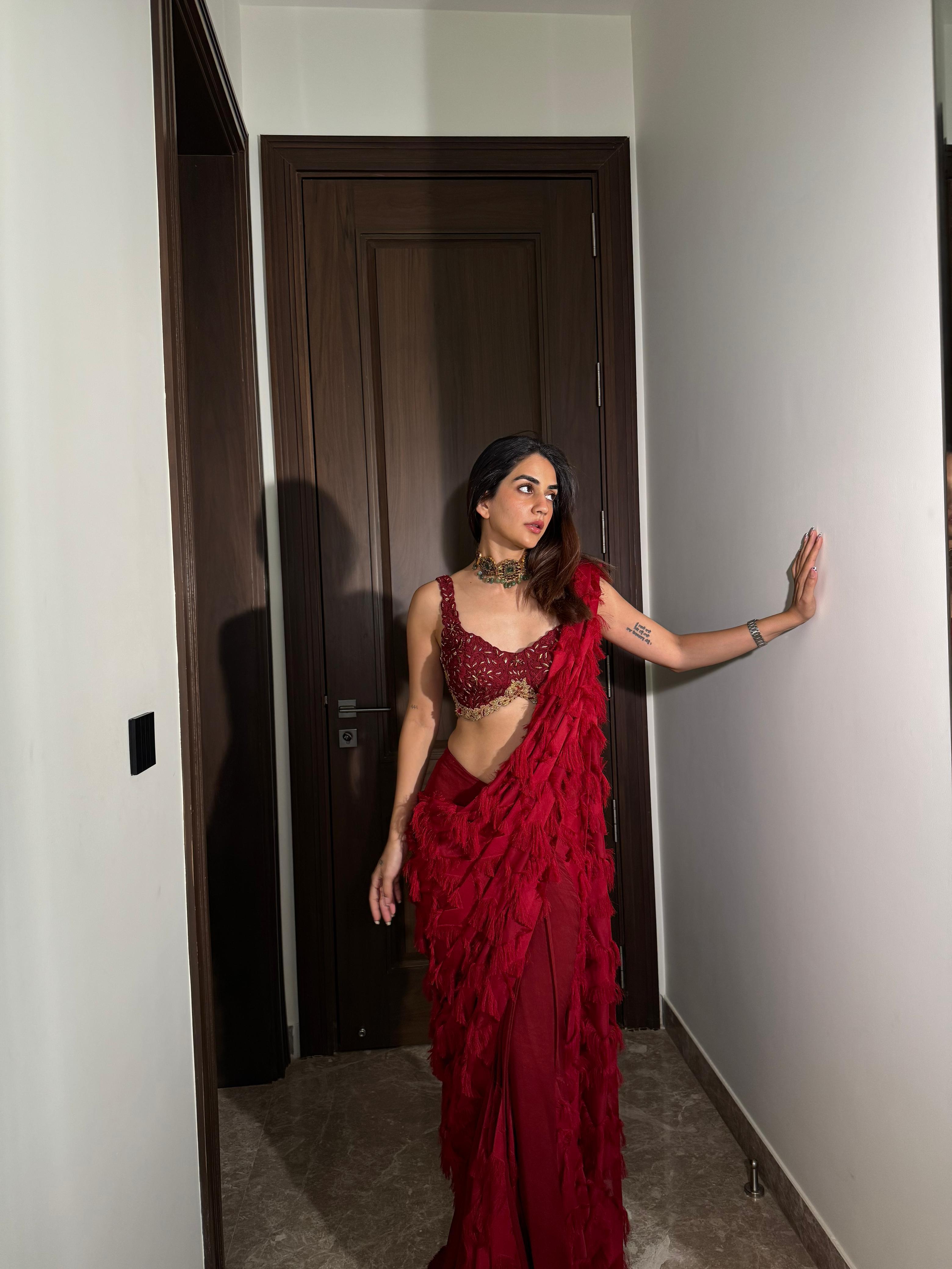 Karma Dhingra in ANKUR J red signature drape saree