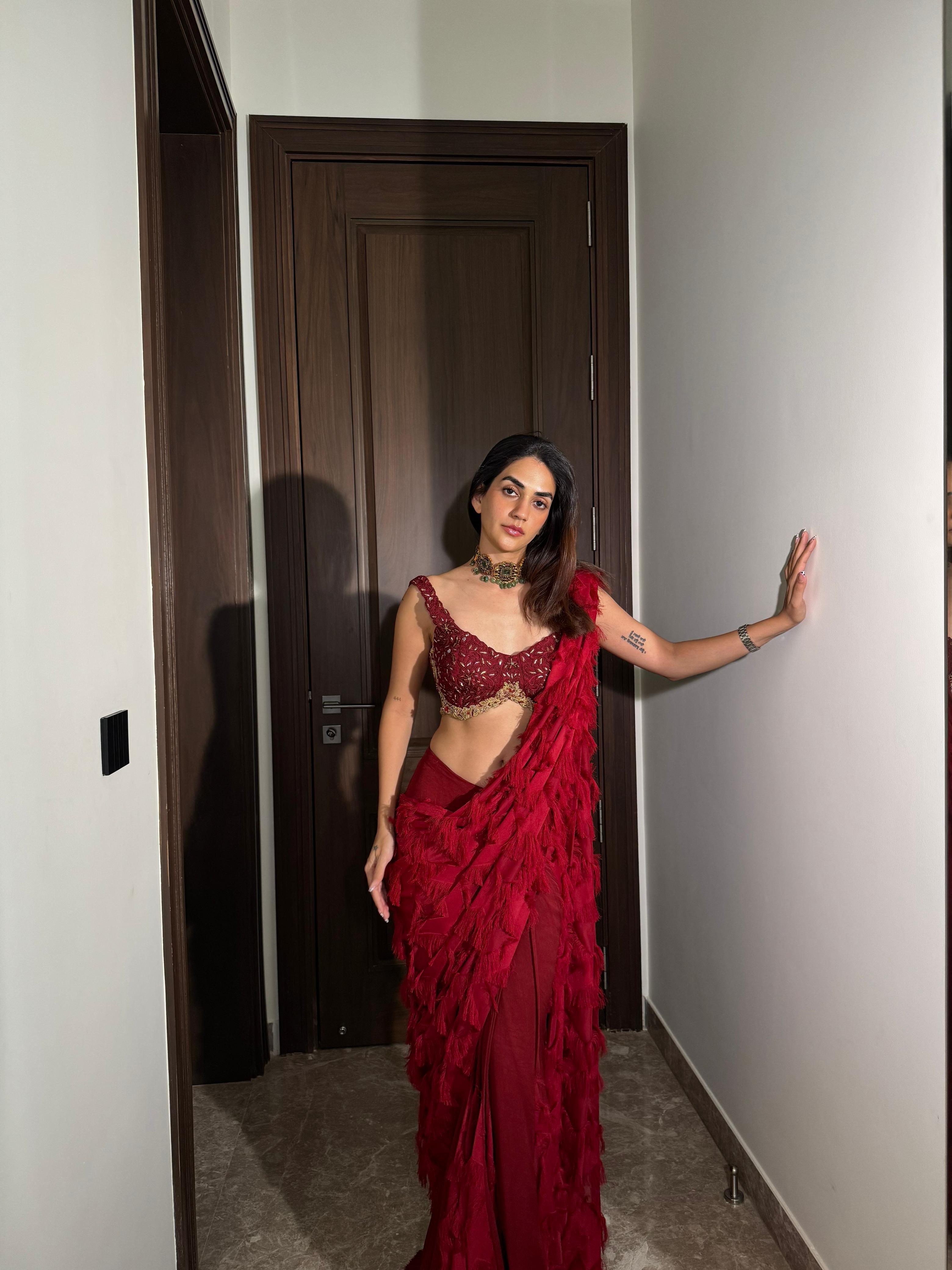 Karma Dhingra in ANKUR J red signature drape saree