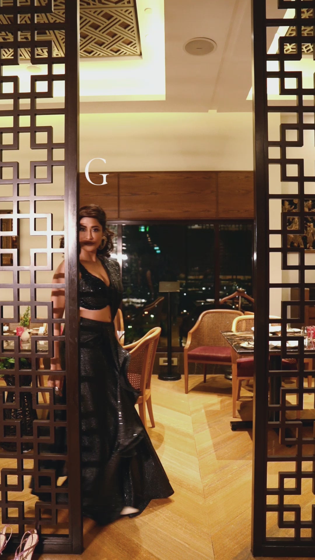 Chitrangada Black shimmer drape saree