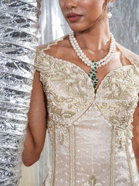 Off shoulder corset with fish skirt indowestern paired with cape style veli neo