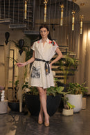 Off white crochet overlay dress with a belt and graphic printed pockets