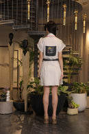Off white crochet overlay dress with a belt and graphic printed pockets