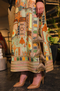 Long slit kurti , embellished with hand embroidery and tassels