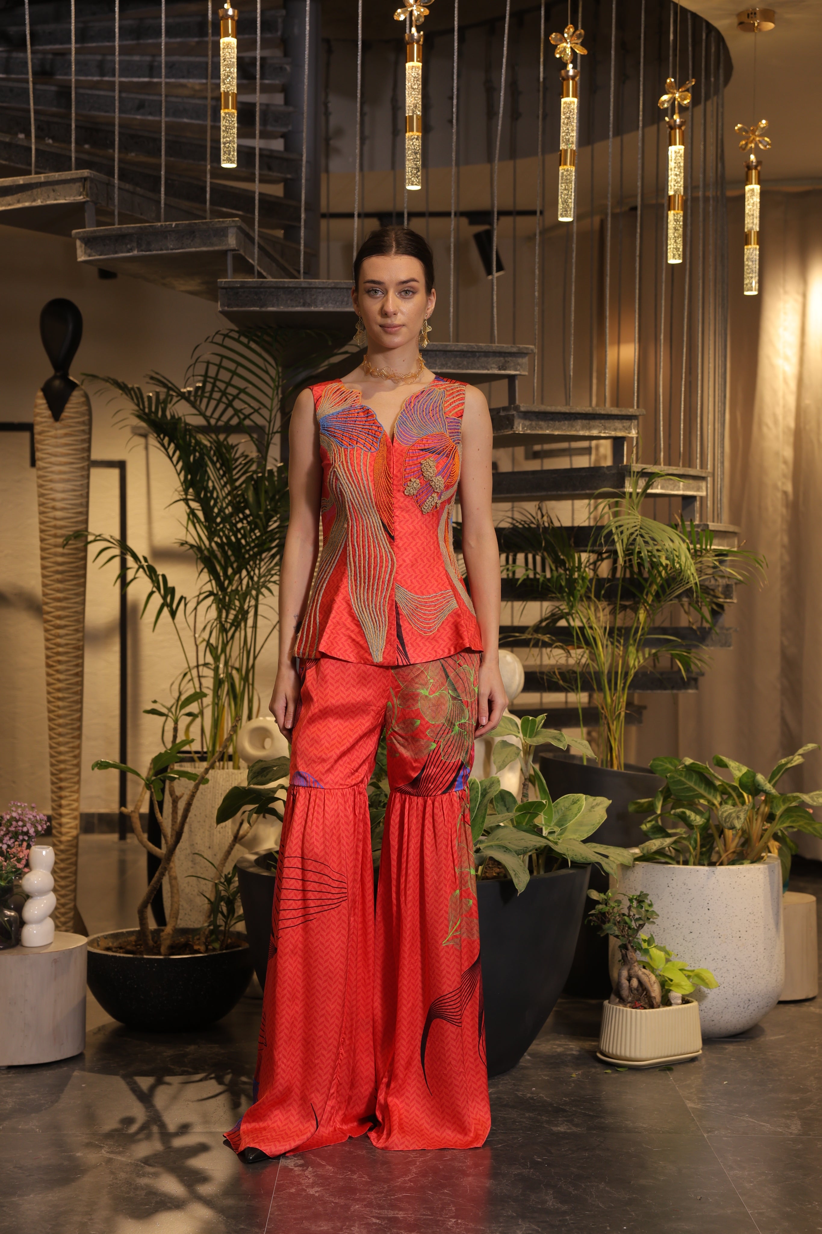 Crimson printed ethnosplash peplum cut bodice with garara pants.