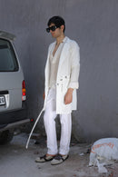 White overlay with AJ logo printed belt paired with shirt and pants