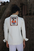 Off white shirt with large printed pockets paired with pants