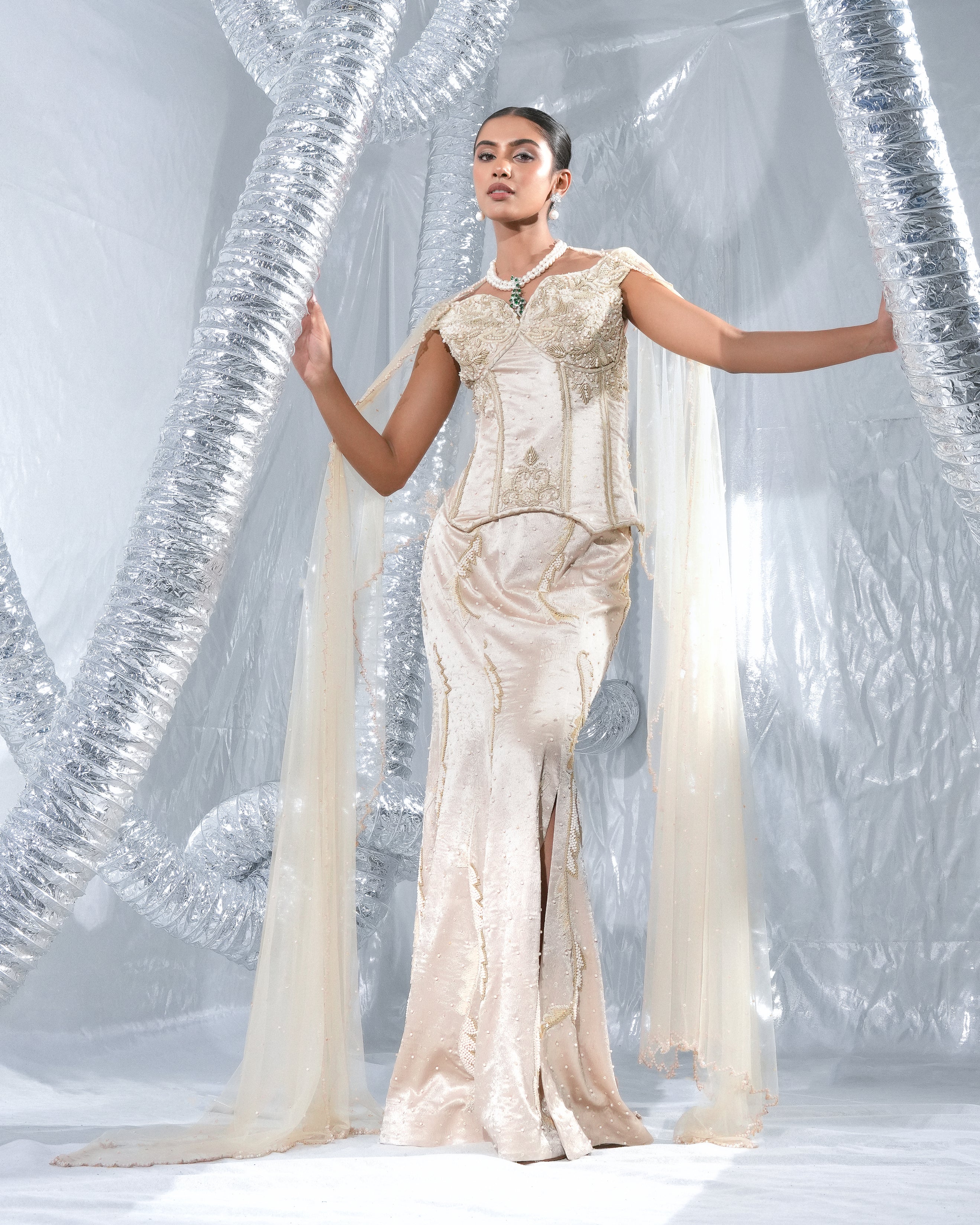 Off shoulder corset with fish skirt indowestern paired with cape style veli neo