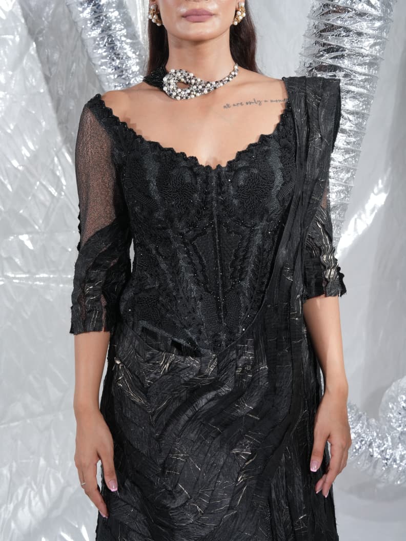 Black corset saree, embellished with crushed and failed ethno strip with signature zardozdi embroidery neo