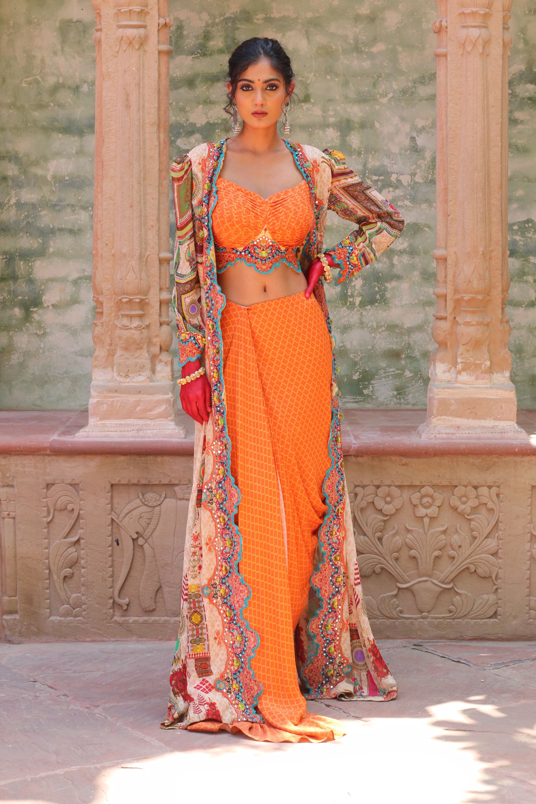 SIGNATURE PRINTS EMBROIDERED APRICOT BUSTIER AND DRAPE SKIRT WITH OVERLAY INDO WESTERN